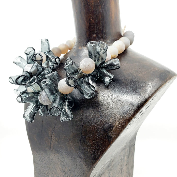 Necklace of handmade grey borosilicate glass beads and grey agate beads, with a silver clasp. 