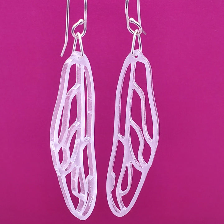 Dragonfly and Cicada Wing earrings in clear glassy acrylic.