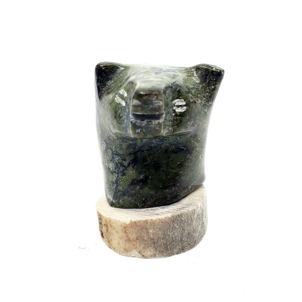 Bear Head, miniature green serpentine carving on caribou antler, by Piona Keyuakjuk from Pangnirtung, Nunavut.