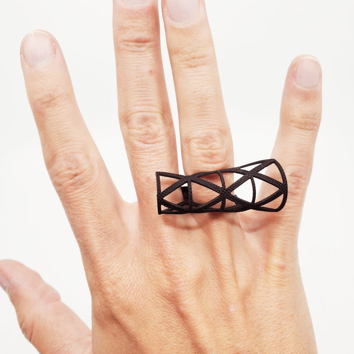 Ring laser cut from black EPDM rubber.