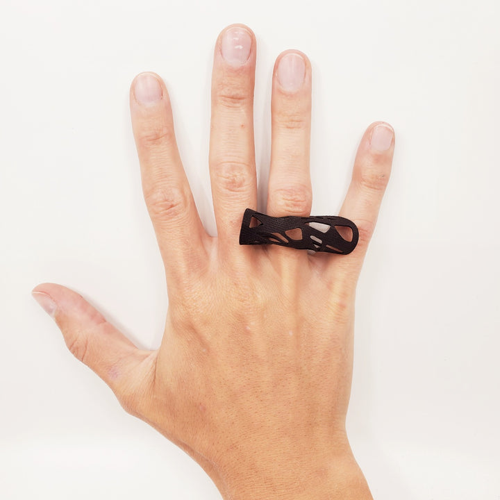 Ring laser cut from black EPDM rubber.