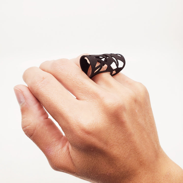 Ring laser cut from black EPDM rubber.