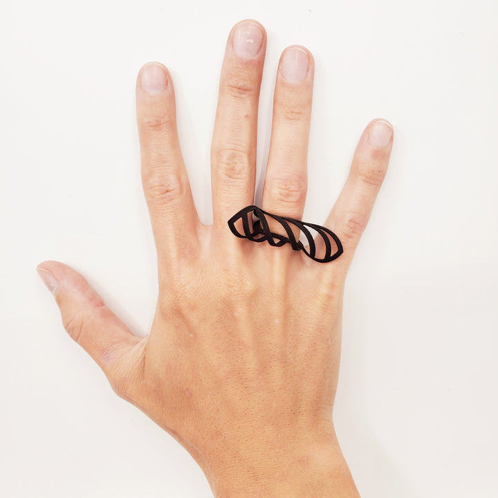 Ring laser cut from black EPDM rubber.