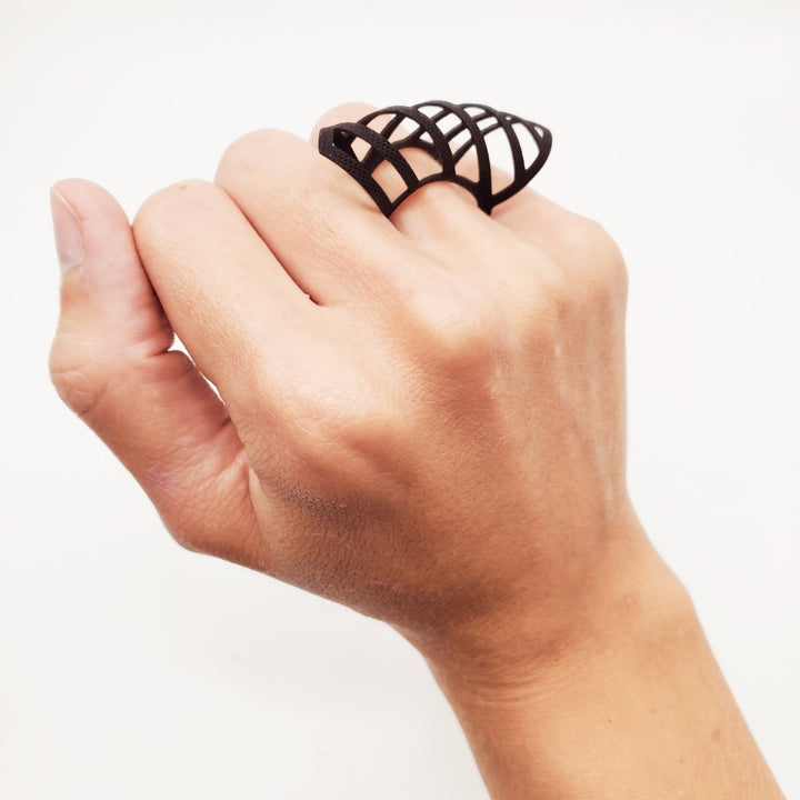 Ring laser cut from black EPDM rubber.