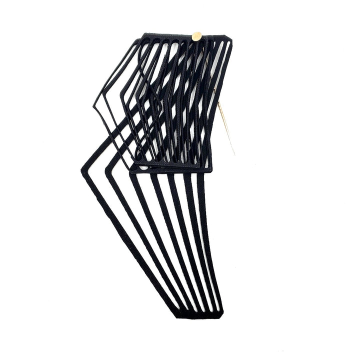 Pin laser cut from black EPDM rubber.