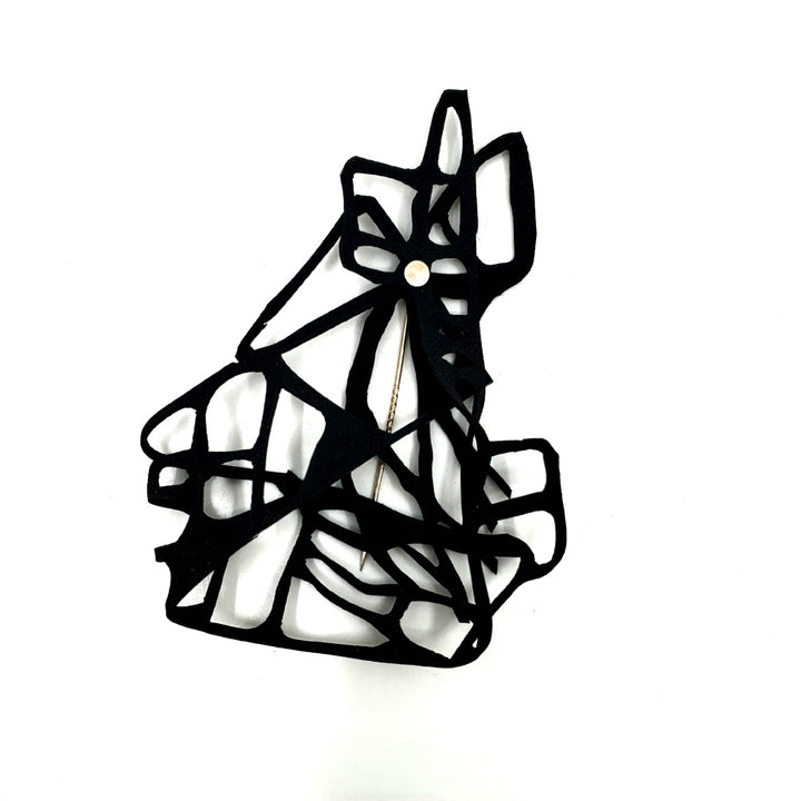 Pin laser cut from black EPDM rubber.