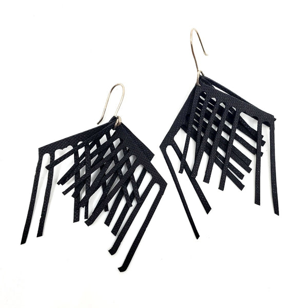 Ultra-light dangle earrings laser cut from black EPDM rubber.