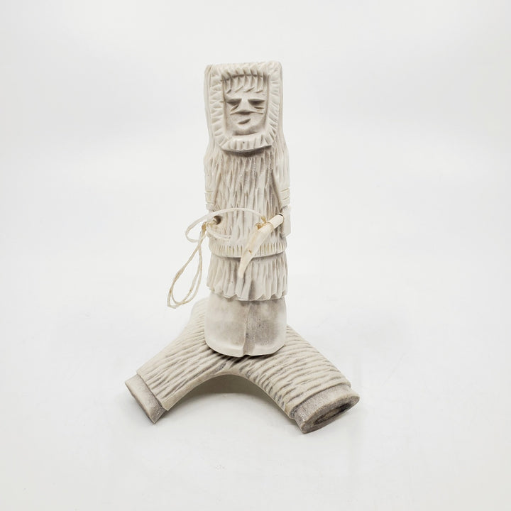 Hunter, caribou antler carving by artist Thomas Nibgoarsi of Arviat, Nunavut.