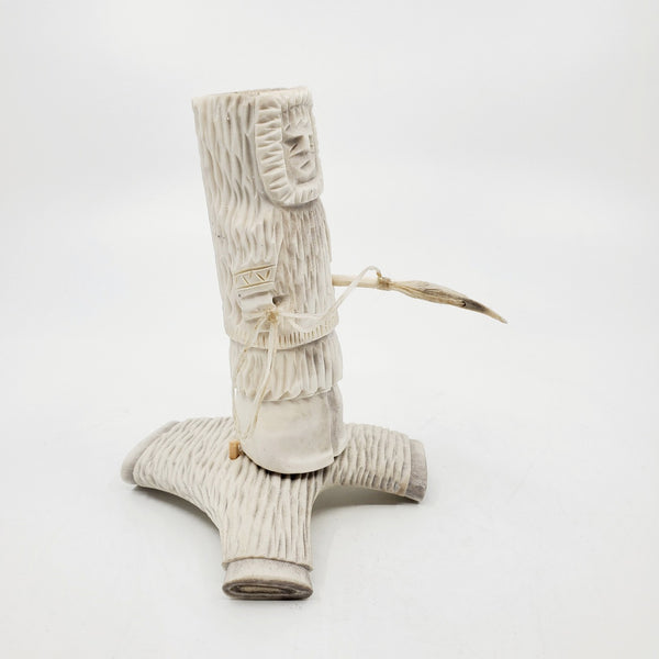 Hunter, caribou antler carving by artist Thomas Nibgoarsi of Arviat, Nunavut.