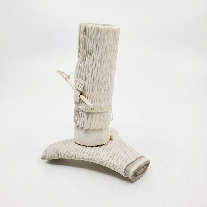 Hunter, caribou antler carving by artist Thomas Nibgoarsi of Arviat, Nunavut.