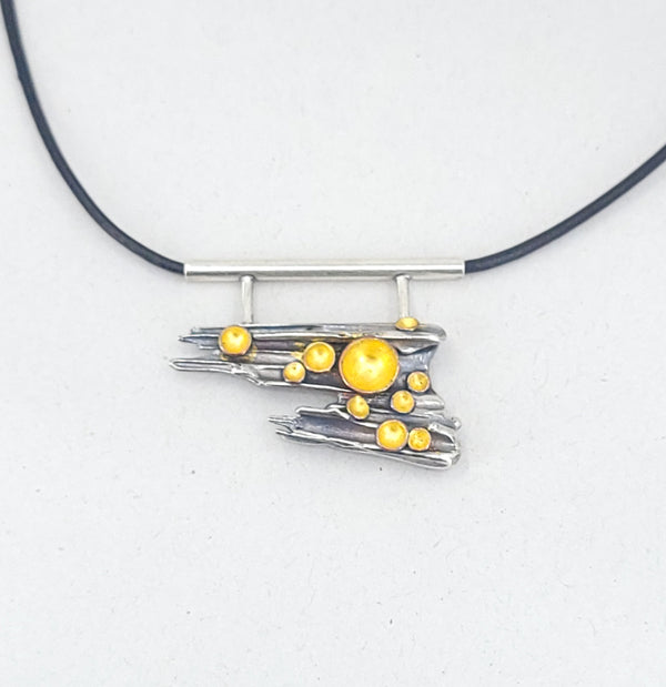 “Forest Floor” Pendant - Sterling silver pendant with 23k gold leaf, copper, and patina.