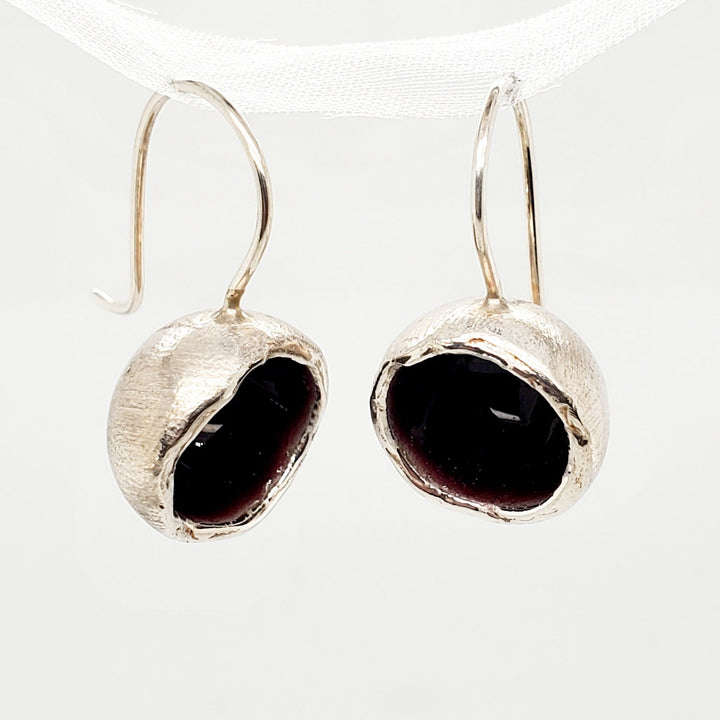 "Boulle" dangle earrings combine sterling silver with enamel in deep plum.
