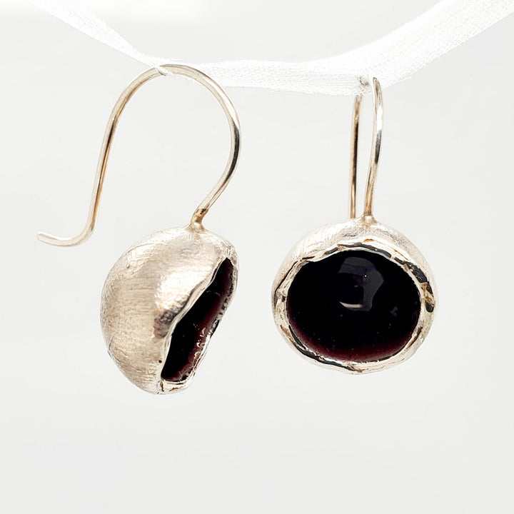 "Boulle" dangle earrings combine sterling silver with enamel in deep plum.