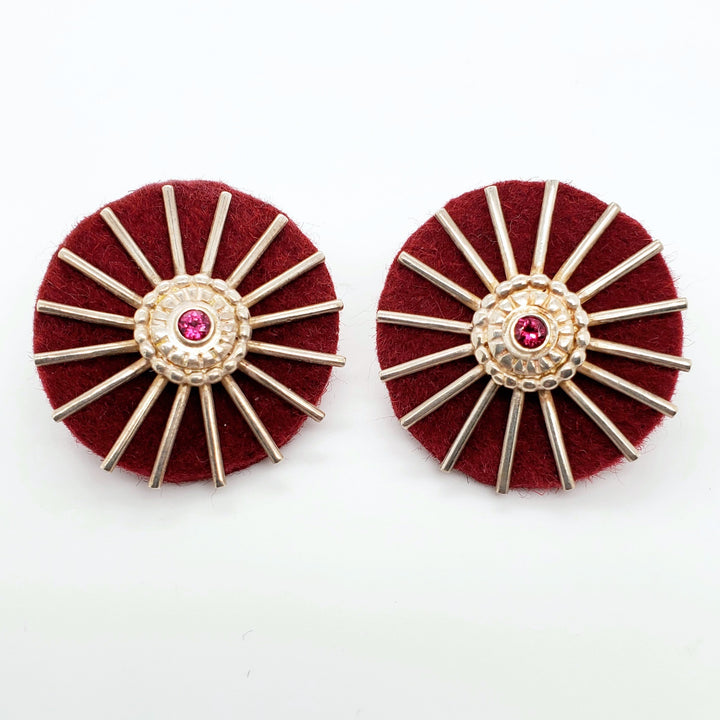 "<em>Roues de charrette</em>": Large stud earrings of silver, pink tourmaline, and felt. 