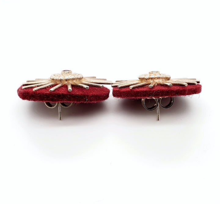 "<em>Roues de charrette</em>": Large stud earrings of silver, pink tourmaline, and felt. 