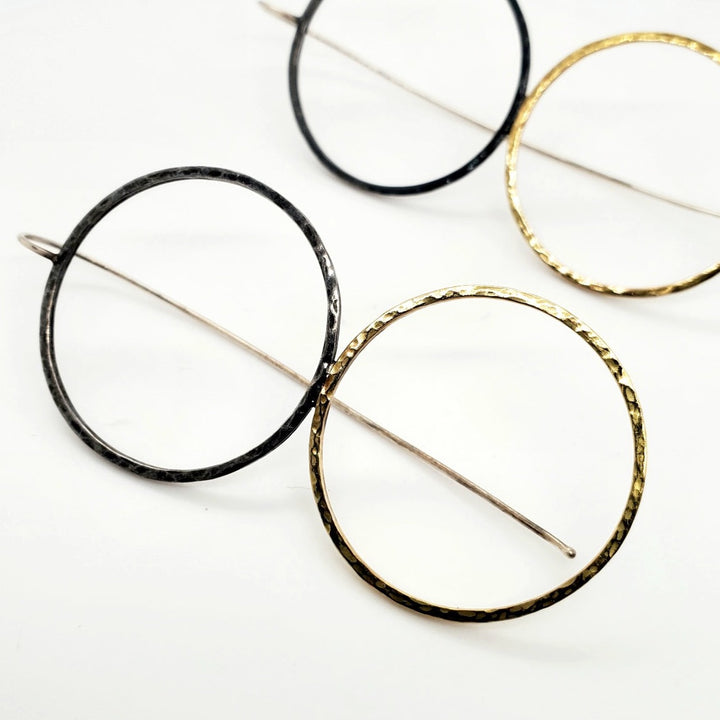 Faire des ronds dans l'eau.  Large, timeless double-circle earrings of forged sterling silver and 14k yellow gold,  7 x  3 cm.