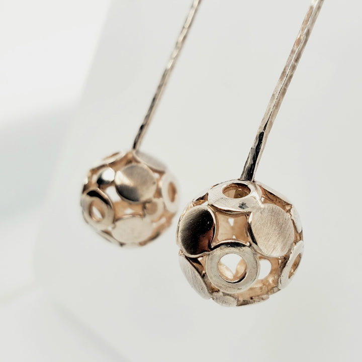 "Boule qui roule" earrings are long (6.5cm) sterling silver studs. The 'boules' forms are 1.5cm in diameter.
