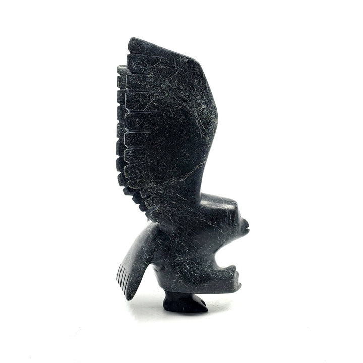 Owl, stone sculpture by artist Parr Parr in Cape Dorset, Nunavut.