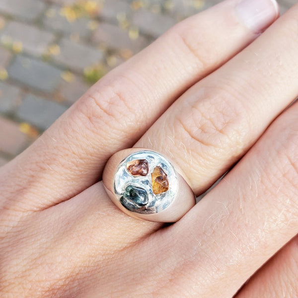 sterling silver signet ring with three rough sapphires in pink, orange, and light blue