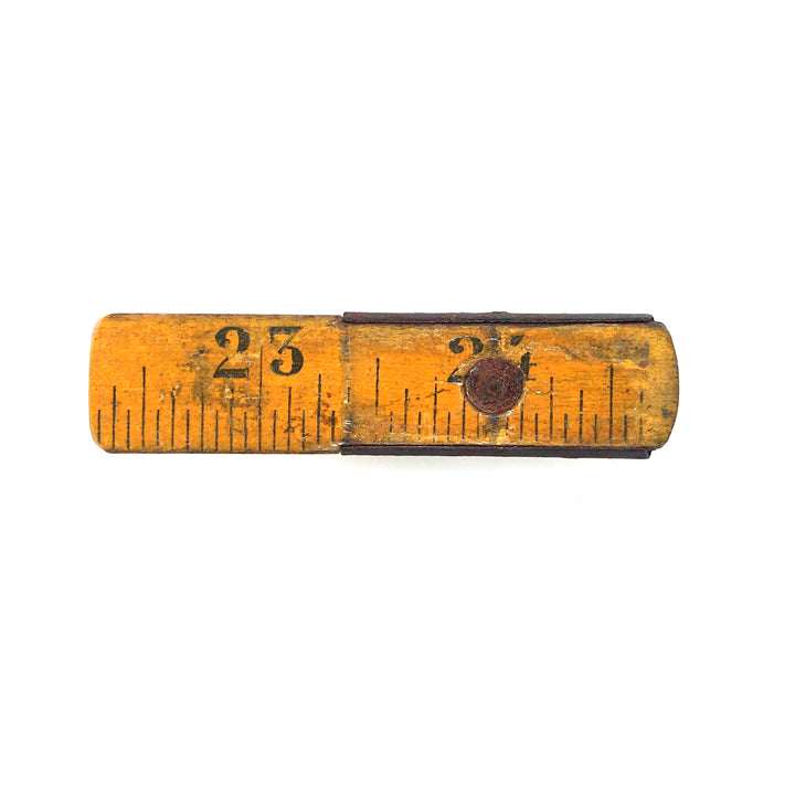 Made to Measure brooch. This wearable mixed media assemblage combines a segment of a vintage boxwood ruler, brass fittings, and sterling silver findings. 