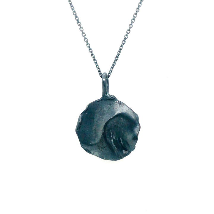 Fold small pendant in oxidized sterling silver.