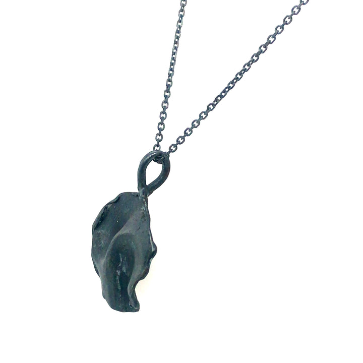 Fold small pendant in oxidized sterling silver.