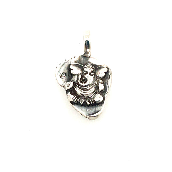 Small Ganesh pendant in sterling silver, with a single diamond to the left of the figure.