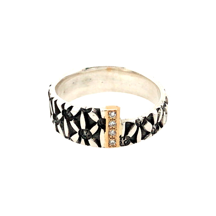 Stamped sterling silver ring. A band of diamonds and 18kt yellow gold joins two asymmetrical square ends. 