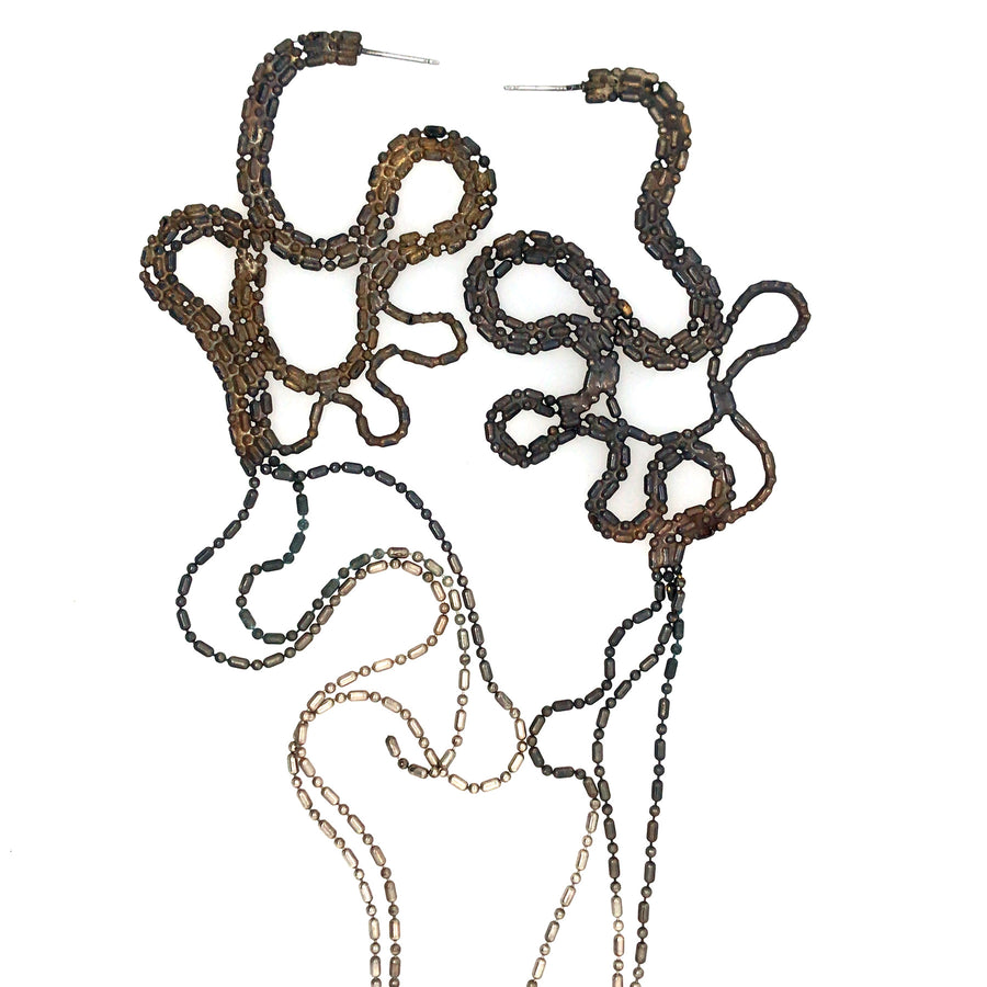 Large and light snake-like earrings of repurposed bamboo chain, with silver plating. 