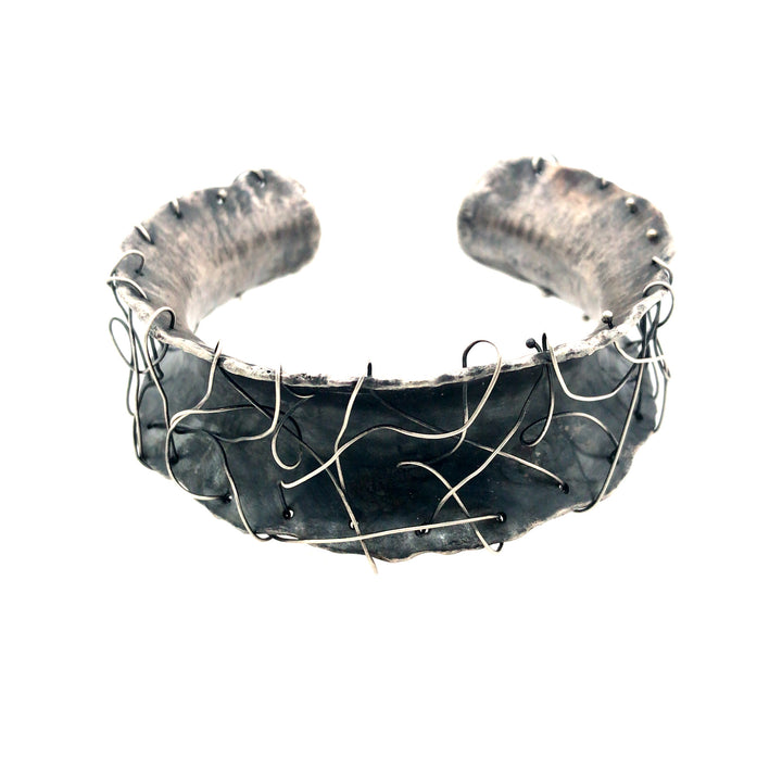 Monomanies motrices cuff bracelet made from sterling silver.