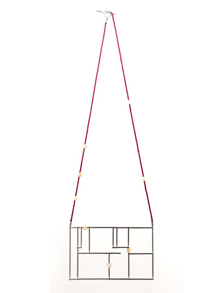 Floor Plan Necklace: Sterling silver with mother of pearl, and a silk cord.