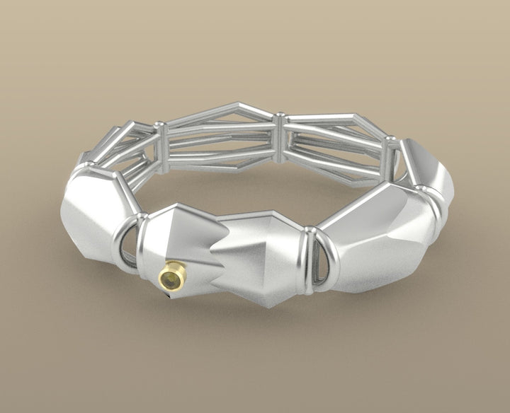 Bracelet No. 04269372, from the Seed Collection. 2023.   Created with algorithmic design, 3D printing, and stone setting, this bracelet is made of sterling silver, 14k gold, and green tourmaline.  8x8x3cm
