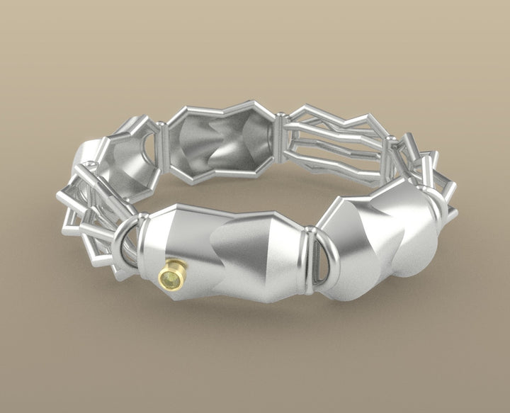 Bracelet No. 26445081, from the Seed Collection. 2023.   Created with algorithmic design, 3D printing, and stone setting, this bracelet is made of sterling silver, 14k gold, and chrysoberyl stones.  8x8x3cm