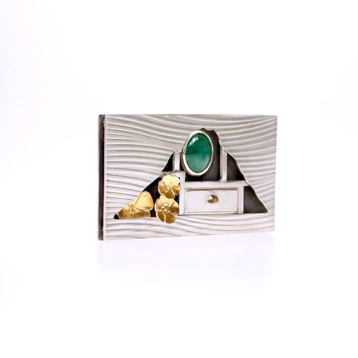 Hometown: Taiwan Duobaoge (curio boxes) - Silver Brooch, 2022.  Created with cold connection (riveting, rolling printing, bezel setting, oxidation, and Keum-boo, this brooch is made of sterling silver, 18k yellow gold, gold foil, and jade. The inside elements can be customized.  6x3.6x0.7cm