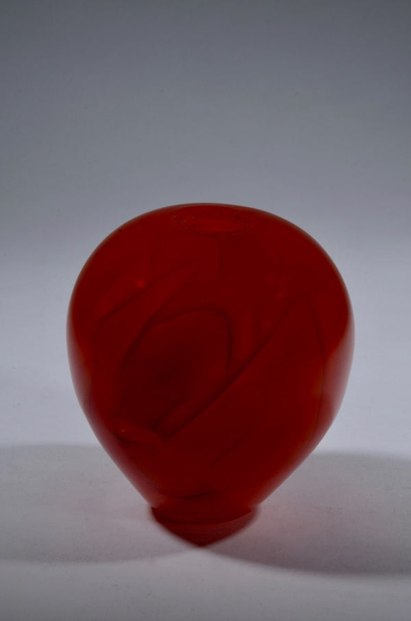 Shadow Vase Series: red glass vessel with shards captured within the layers of the glass and a sandblasted surface, 5" x 4.5". 
