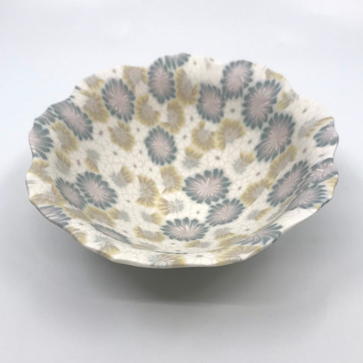 Small multicolour ceramic floral bowl in blue and brown-green with a delicate scalloped edge, made with the nerikomi ceramic technique.