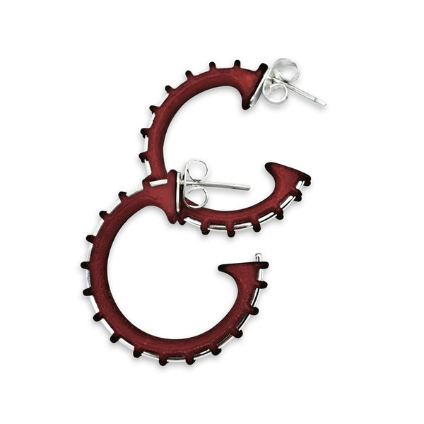 Red hoop earrings with a white background