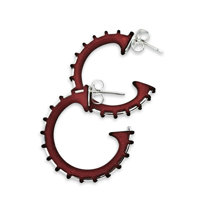 Red hoop earrings with a white background