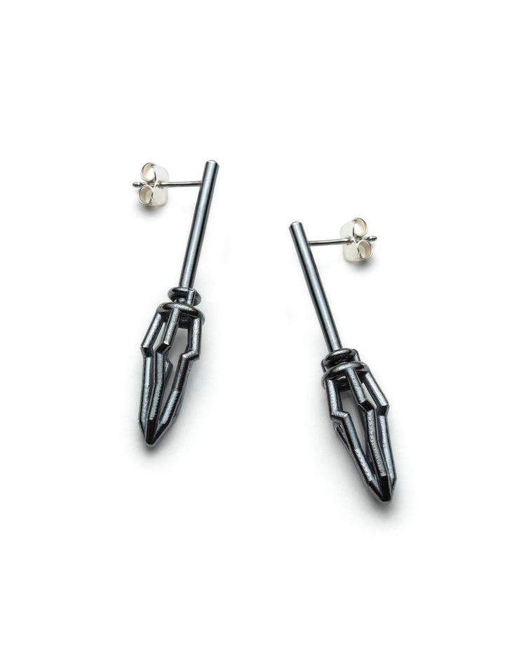 Earrings No. 22459228, from the Seed Collection. 2023.   Created with algorithmic design and 3D printing, these earrings are made of oxidized sterling silver.  5x2x1.5cm each
