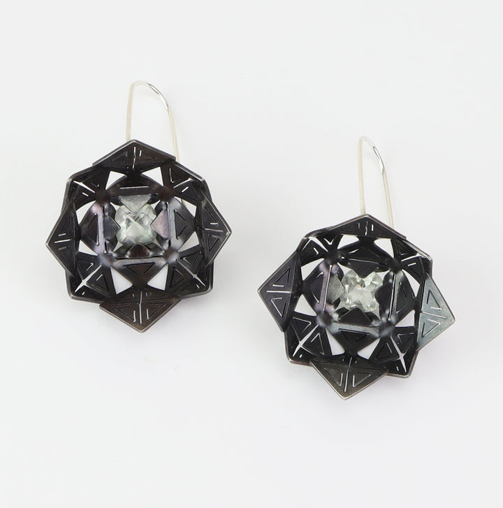 Flora Earrings - Oxidized   The hand cut sterling silver delicately captures the clear green prasiolite stones in the centre of each flower.   5x2.5x1.5cm, 2023