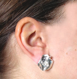 Fold. Round stud earrings of folded sterling silver.