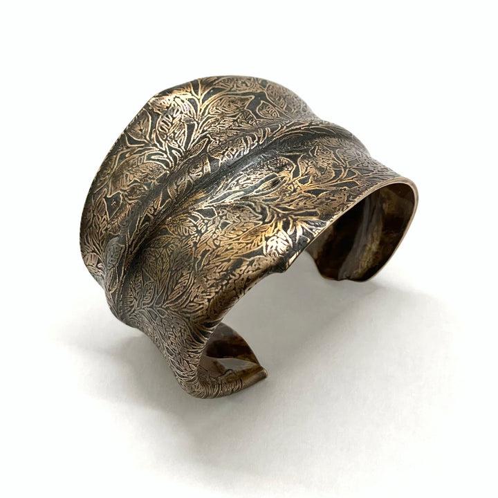 Leaves cuff. Bronze cuff bracelet with center line fold, richly textured with an etched leaf pattern and black patina. Fits size small. 