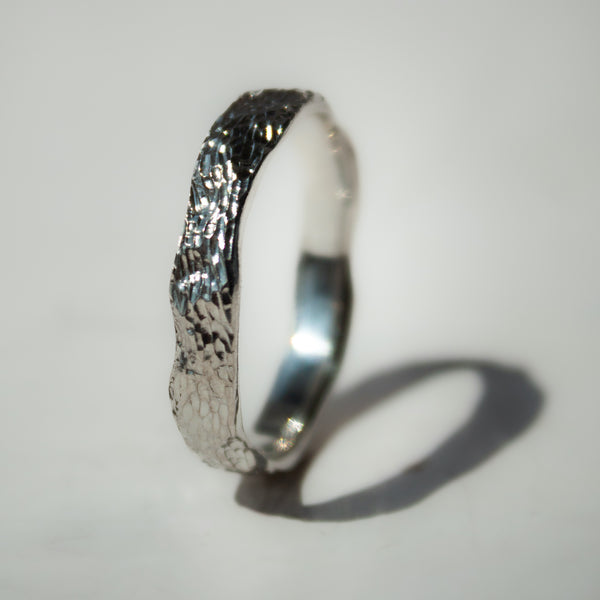 Silver ring with textured band 