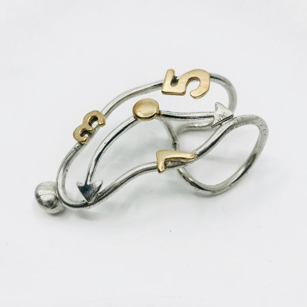 Melting clock ring in silver and brass