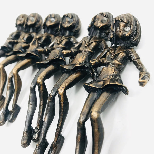 Bracelet of bronze figurines linked by arm