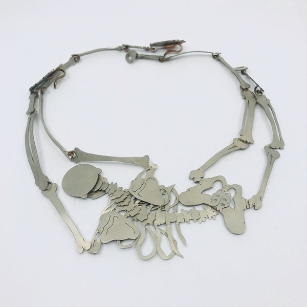 Necklace with skeletal design on a white background
