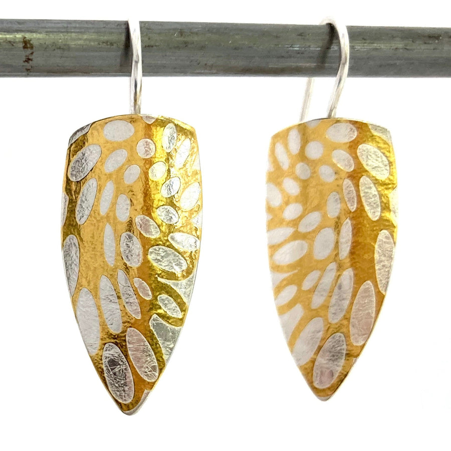 These Palmyres La Pivotante earrings are comprised of silver and 24 karat gold which has been diffusion bonded and formed, resulting in an exciting interplay between two fine metals.