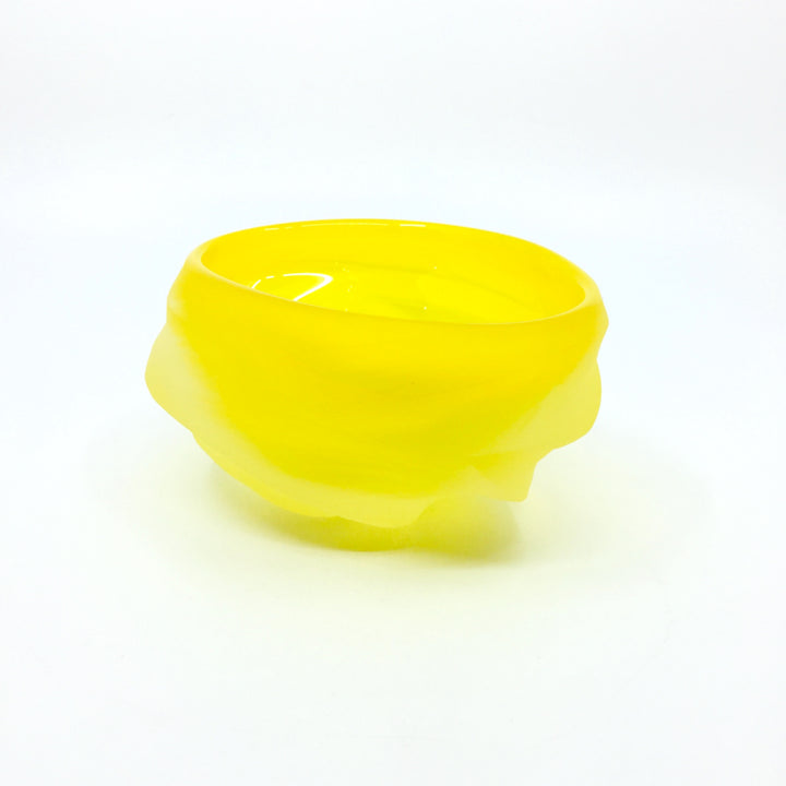 Undula Carved bowl in brilliant yellow. 