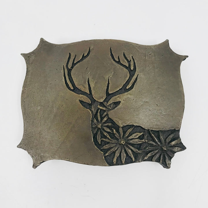 Daisy Stag is a cast bronze belt buckle. It comes with its own hand-crafted wooden storage box. 