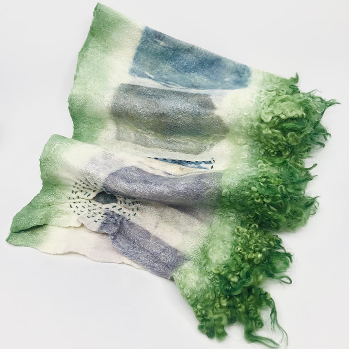 Green and blue scarf, created with hand-dyed silk and merino wool with recycled materials.